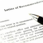 A pen on top of a letter of recommendation.