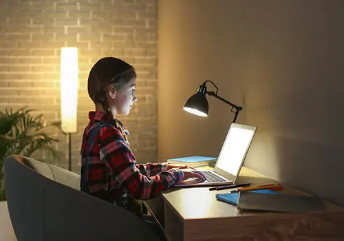 A girl working at her laptop computer.