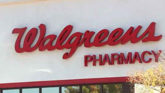 Walgreens pharmacy logo on a storefront.