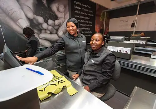 Woolworths cashiers smiling